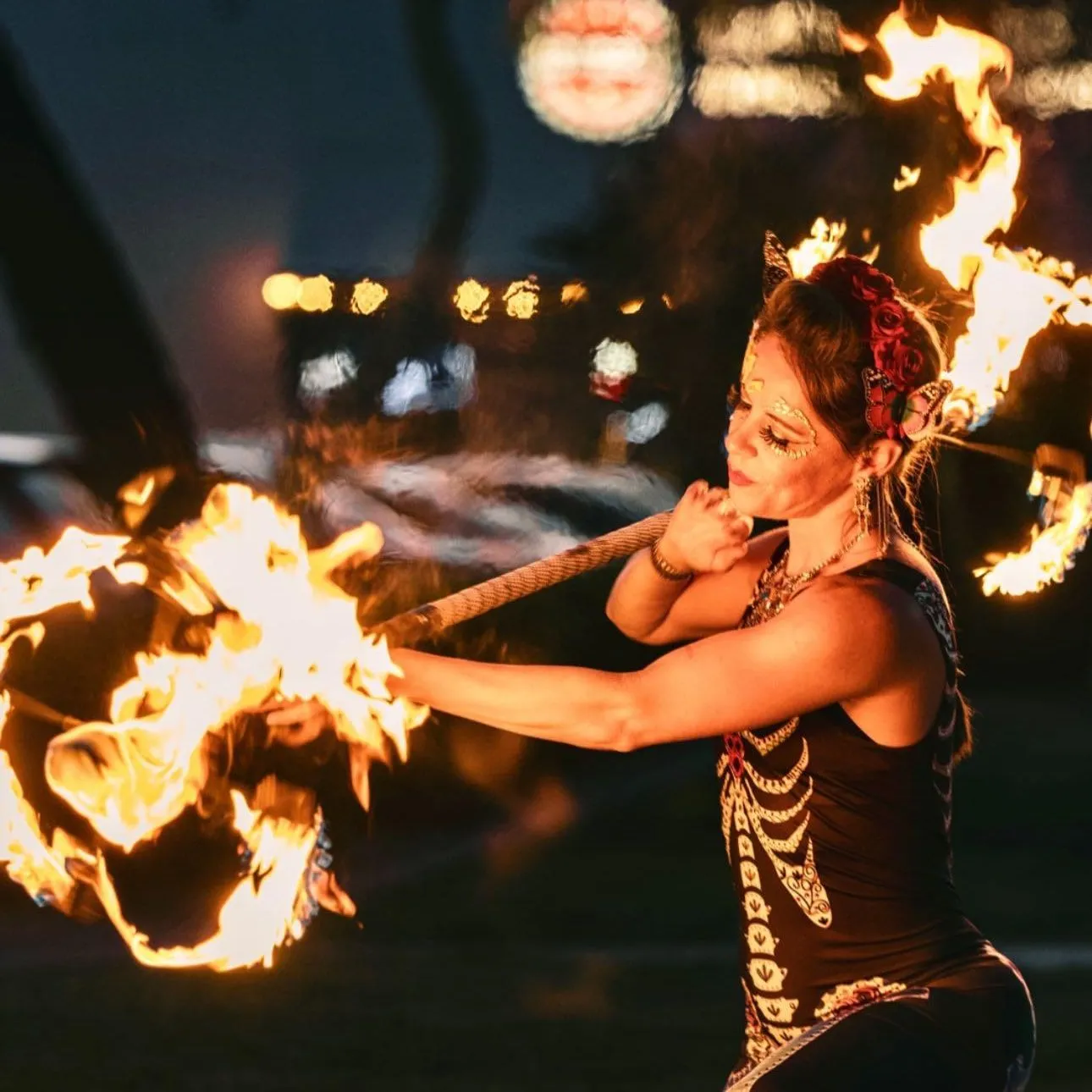 A woman performing with a Dragon Staff.