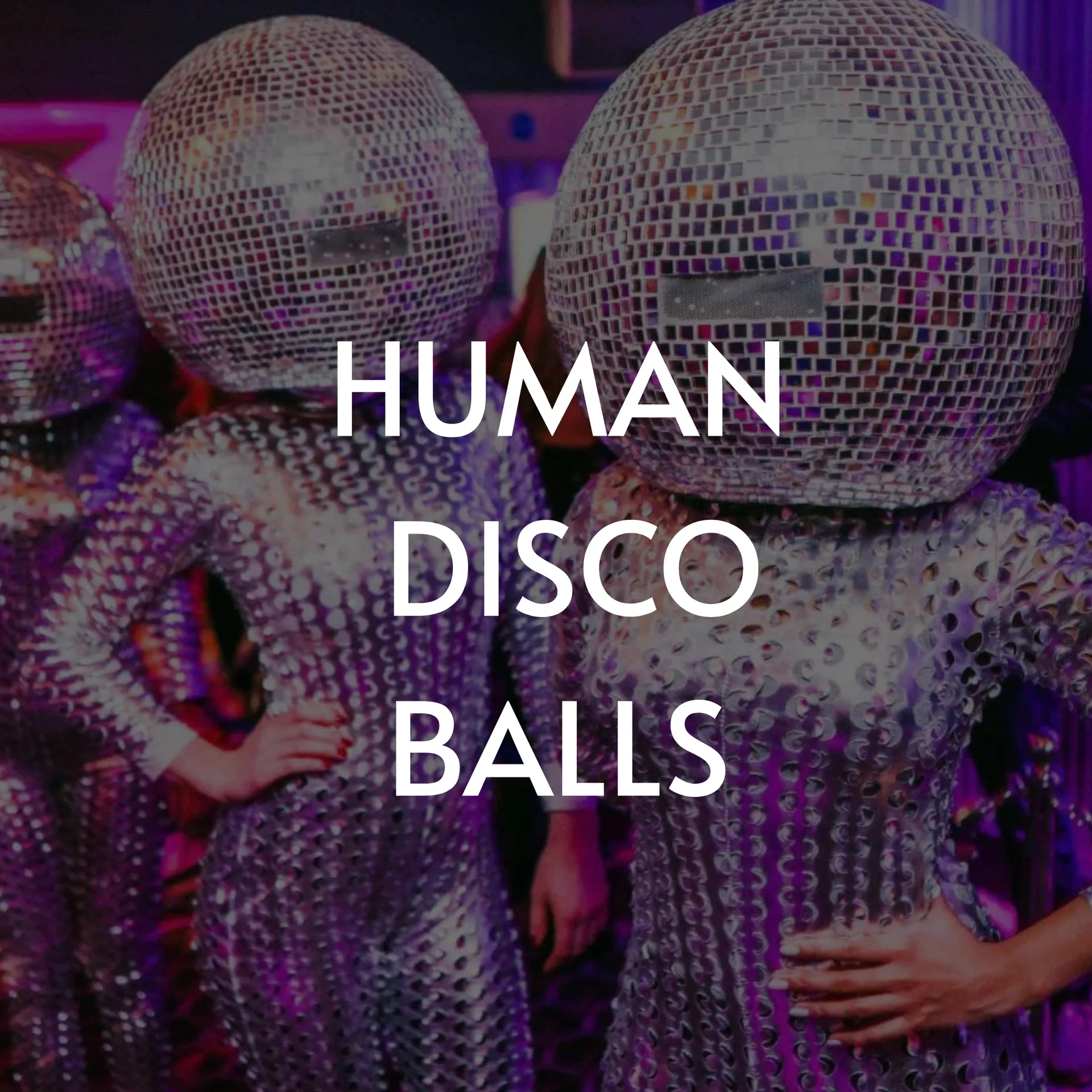 Three people in shiny silver sequined outfits, with disco ball heads.