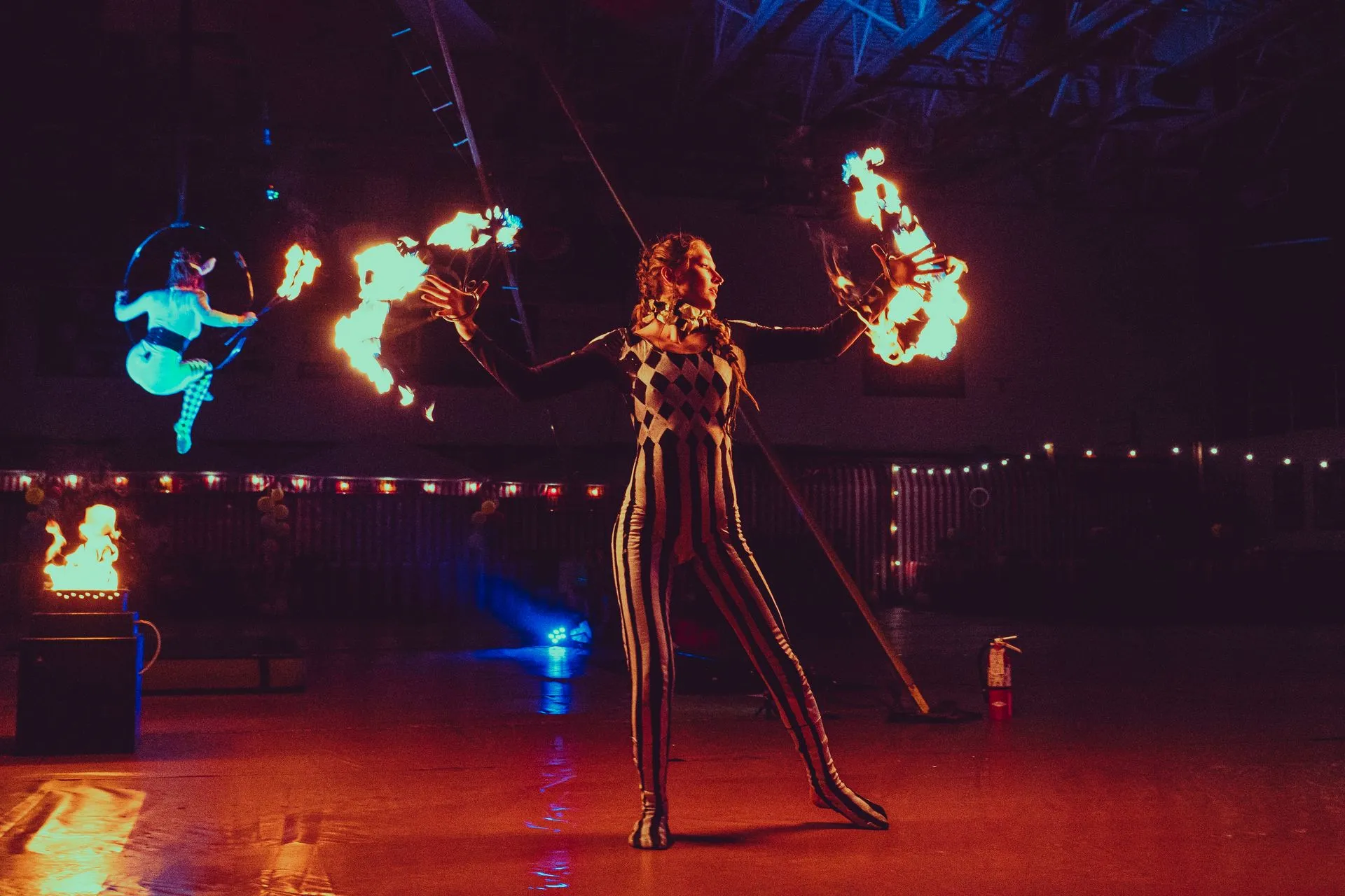 A woman performing with Fire Fans.