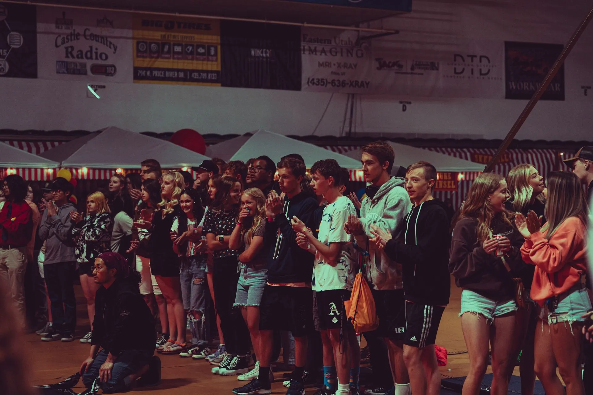 A large group of people are standing in a line.