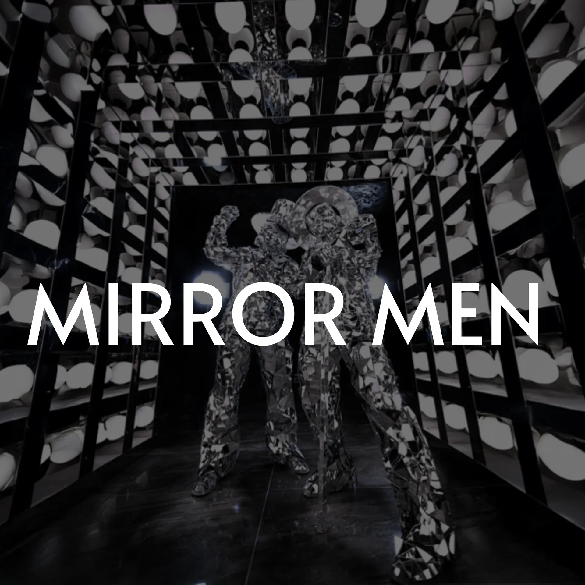 Mirror men statues in a hallway, surrounded by lights and mirrors.