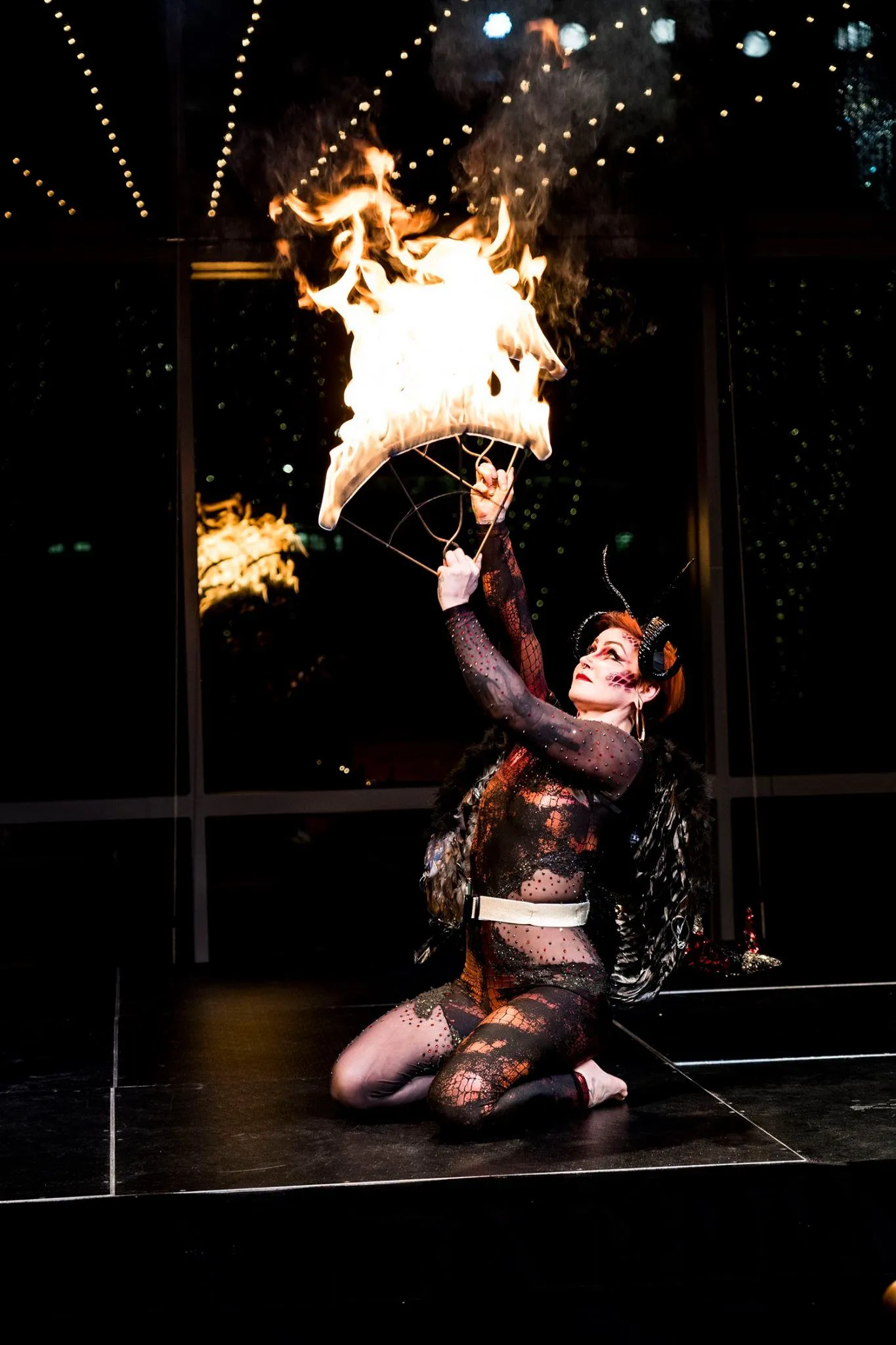 A performer with fire fans.