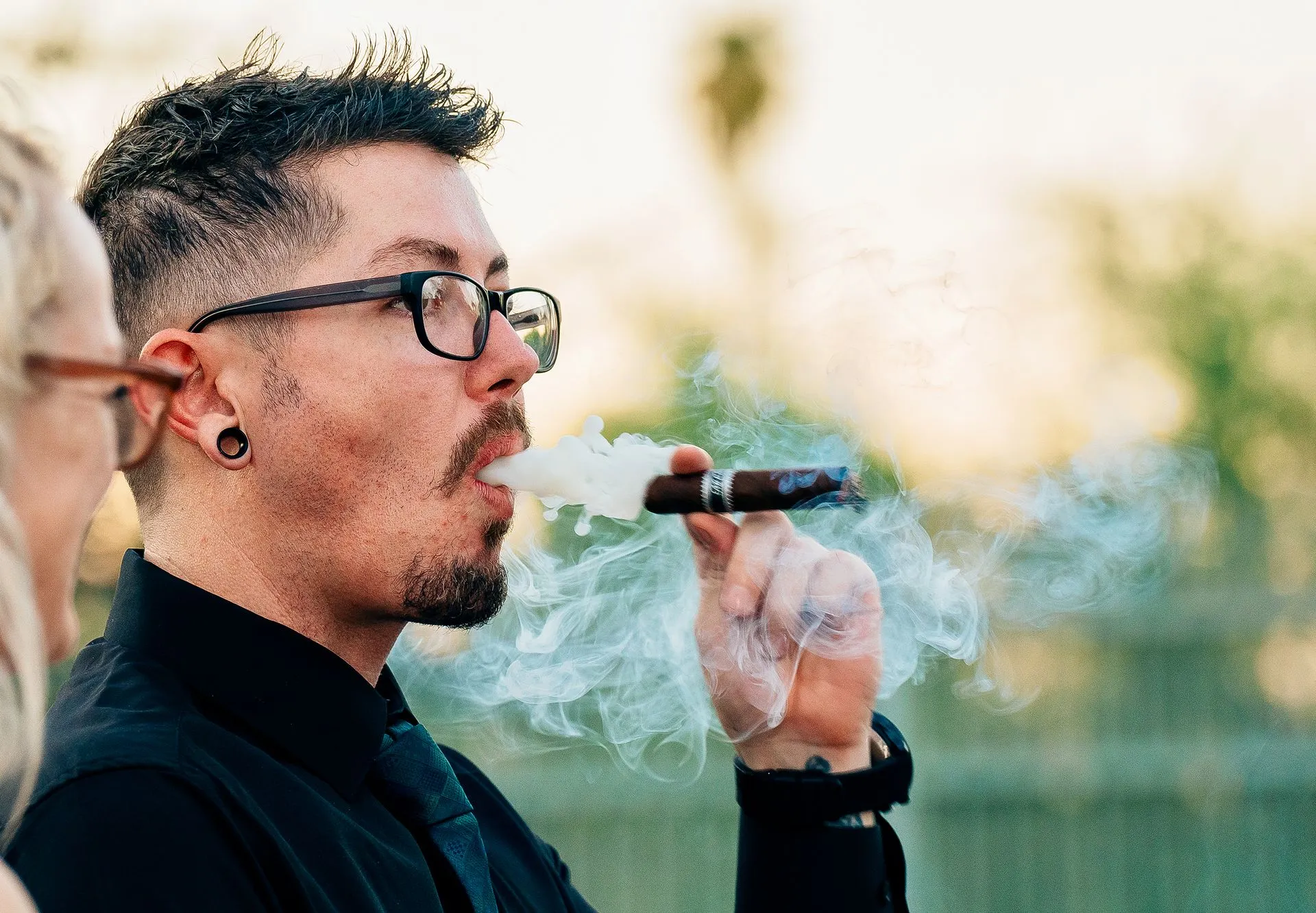 A man smoking a cigar.