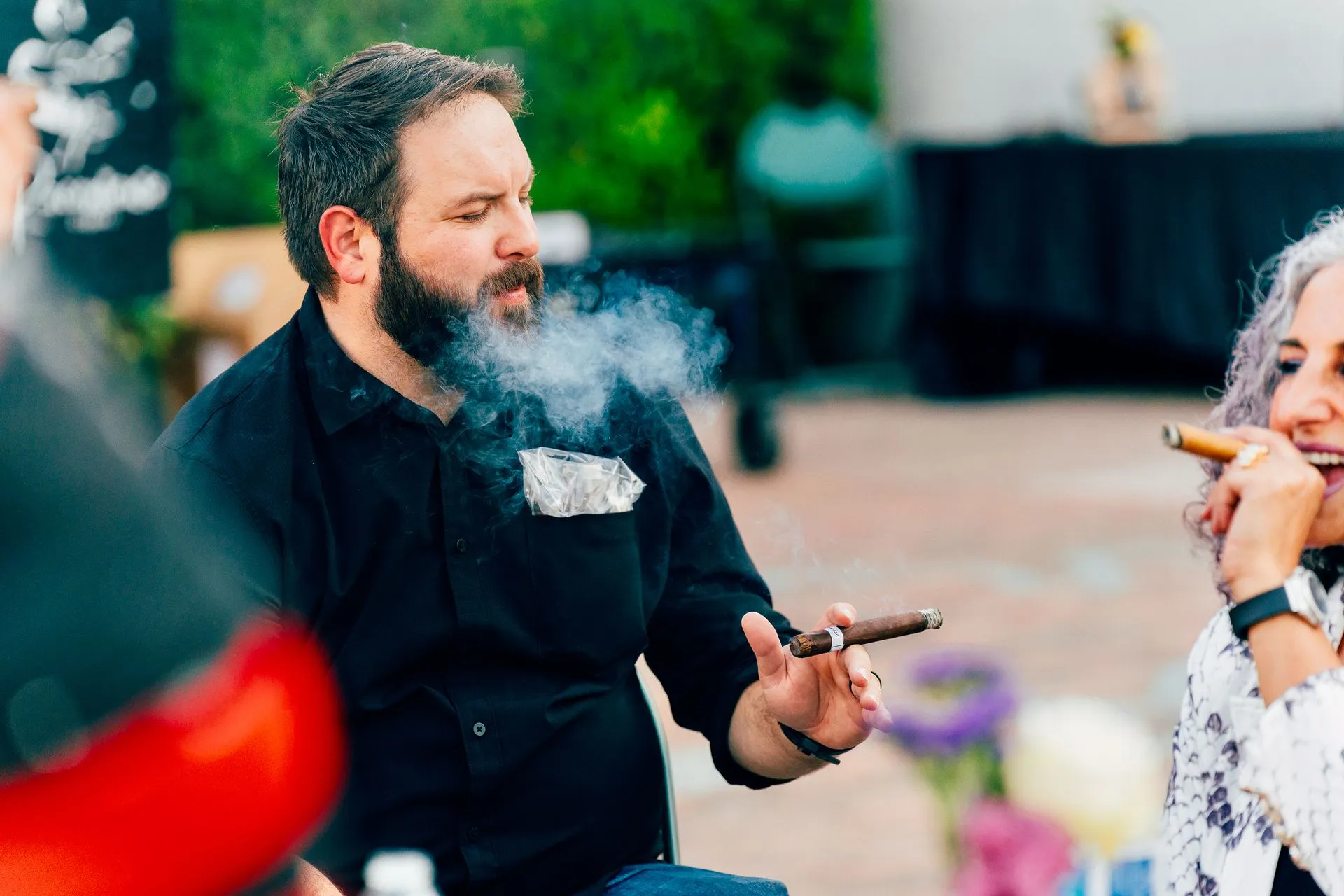 A man smoking a cigar.