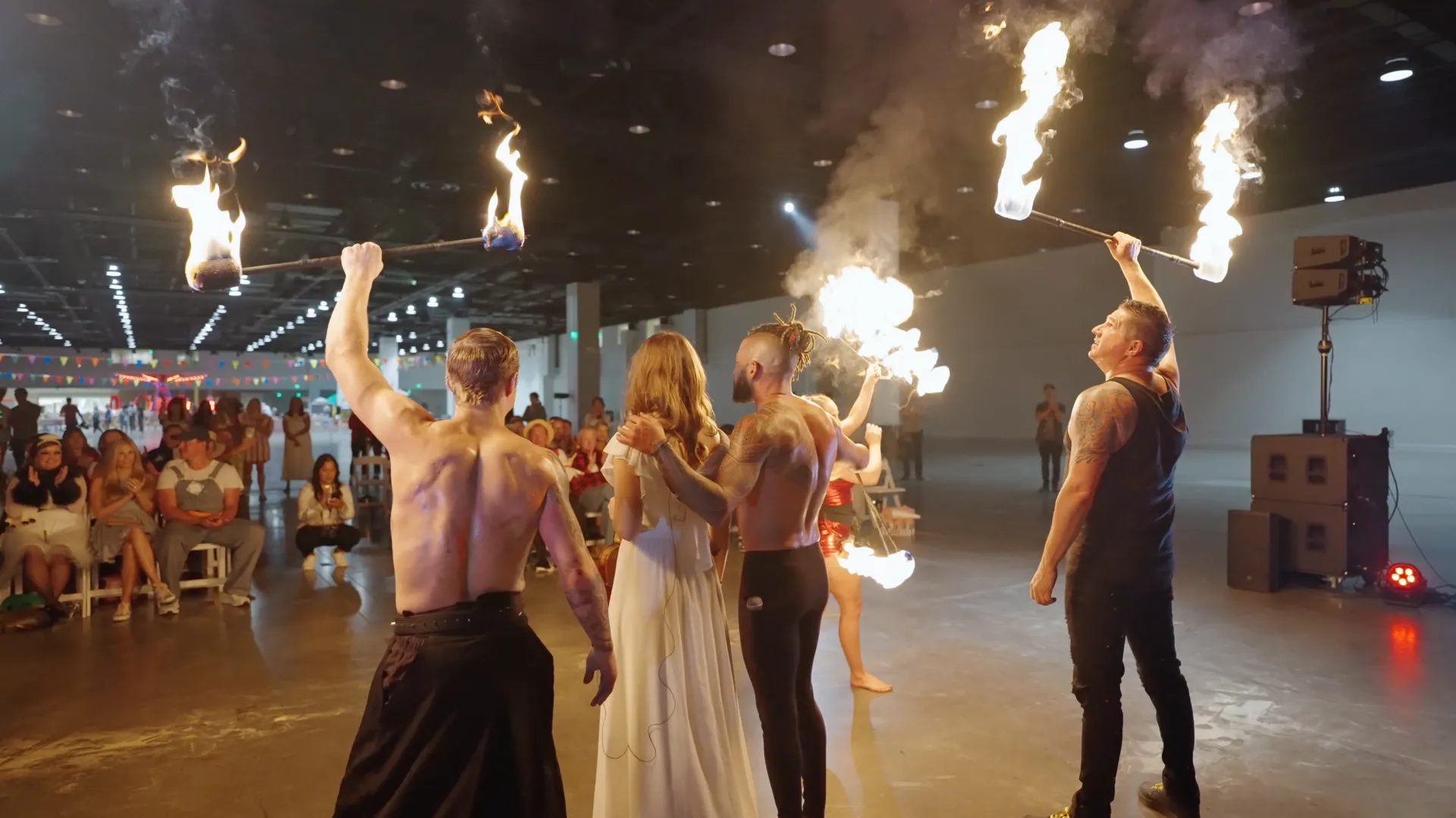 A group of performers in a show with fire.